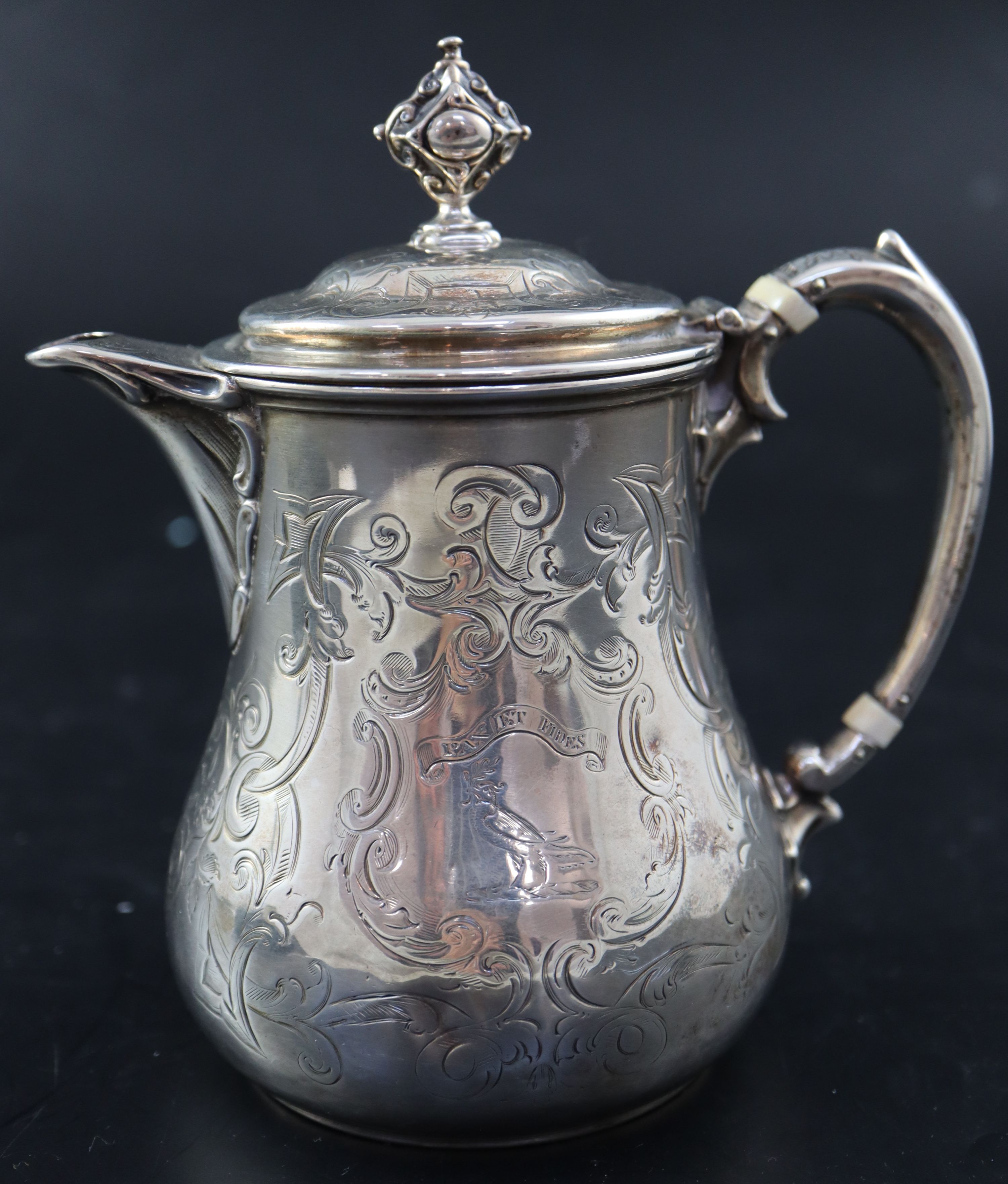 A Victorian small engraved silver hot water pot, 5.7cm, gross 10.5oz.